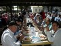 Local seniors enjoy traditional meal of BBQ chicken, potatoe salad, and fruit salad.  